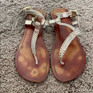 Go Max gold gladiator thong buckle sandals.